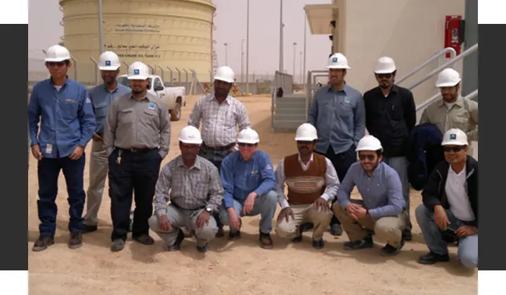 Group of industrial workers at chemical plant